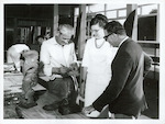 Title
Rotorua

Publicity Caption
The Master Carver, John Taiapa, shows visitors the intricacies of Maori Carving at the Rotorua Arts and Crafts Institute's carving centre. Whakarewarewa Thermal Reserve, Rotorua.

Photographer
Mr. Anderson.