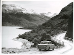 Title
Haast Road

Publicity Caption
Haast Road - Waterfall Creek Bridge, Lake Wanaka looking towards Mt. Albert.

Photographer
Mr. Anderson.