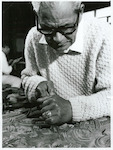 Title:
Maoris - Carving

Publicity Caption:
Mr John Taiapa, Head Carver at the Maori Arts and Crafts Institute, Rotorua

Photographer:
R Anderson