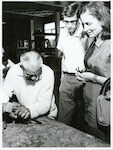 Title:
Maoris - Carving

Publicity Caption:
Tourists watching Mr John Taiapa, Head Carver, at the Maori Arts and Crafts Institute, Rotorua.

Photographer:
R Anderson