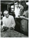 Title:
Maoris - Carving

Publicity Caption:
Tourists watching Mr John Taiapa, Head Carver, at the Maori Arts and Crafts Institute, Rotorua.

Photographer:
R Anderson