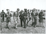 Title:
Scouting

Publicity Caption:
Charles Upham V C and Bar, visits Upham sub camp at the 5th N Z Jamboree

Photographer:
D Nicholson