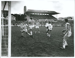 Title:
Sports - Soccer

Publicity Caption:
International Soccer, England v N.Z. Invitation XI at Basin Reserve, Wellington on June 2nd, 1969. The score was England 7 - N.Z. 1. N Z Goalkeeper, Derrick Phillips takes cleanly a "crossed" ball meant for the oncoming England forward, Ian Morgan

Photographer:
Mr R Coad