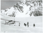 Title:
Canterbury - Tasman Glacier

Publicity Caption:
Cessna Ski Plane and Tourists on the Tasman Glacier, Mount Cook in the background, Canterbury.

Photographer:
R. Anderson