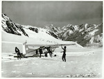 Title:
Canterbury - Tasman Glacier

Publicity Caption:
Cessna Ski Plane and Tourists on the Tasman Glacier, Mount Cook in the background, Canterbury.

Photographer:
R. Anderson