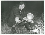 Title:
Sports - Tramping

Publicity Caption:
A Hunter cooking his evening meal, Arthurs Pass National Park, Canterbury.

Photographer:
G. Hutchinson