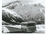 Title:
Canterbury - Sefton, Mt. [Mt. Sefton]

Publicity Caption:
Tour bus leaving Mount Cook, Mount Sefton in the background, Canterbury.

Photographer:
R. Anderson