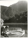 Title:
Fishing - Trout

Publicity Caption:
Peter Donaghy, a fishing guide with the Hollyford Tourist and Travel Co., removing the fly from a freshly caught brown trout, Fiordland National Park. Otago

Photographer:
R. Anderson