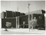 Title:
Town Hall, Kilmore Street

Publicity Caption:
Frontage and main entrance to the Christchurch Town Hall. Circular roof on left is the James Hay Theatre.

Photographer:
J Waddington
