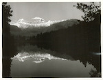 Title:
Westland - Matheson, Lake

Publicity Caption:
Lake Matheson, Mt. Tasman (at left) together with Mt. Cook (at right) mirrored in the reflections of the Lake

Photographer:
M. Berthold