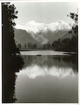 Title:
Westland - Matheson, Lake

Publicity Caption:
Lake Matheson, Mt. Tasman and Mt. Cook (at right) reflected in the mirror like waters

Photographer:
M. Berthold