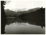 Title:
Westland - Matheson, Lake

Publicity Caption:
Lake Matheson, Mt. Tasman (at left) together with Mt. Cook (at right) mirrored in the reflections of the Lake

Photographer:
M. Berthold