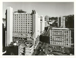 Title:
Wellington City - Buildings

Publicity Caption:
Looking south along The Terrace, with James Cook Hotel in the foreground

Photographer:
T.W. Hann