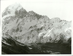 Title:
Canterbury - Cook, Mt.

Publicity Caption:
Mt. Cook and the Hooker Valley. At 12348ft Mt. Cook is the highest mountain in New Zealand. Ice covered moraine in the foreground is all that is left of the Hooker Glacier which has receded further up the valley

Photographer:
T. Hann