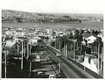 Title:
Otago - Dunedin City

Publicity Caption:
View along Stuart Street of Dunedin and Otago Harbour

Photographer:
R Anderson