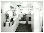 Title: Mobile Hospital  Publicity Caption: St. John Ambulance Mobile Clinic, Auckland Branch.  Young patient receives attention  Photographer: Not identified