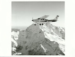 Title: 
TRANSPORT - Air - Aircraft

Publicity Caption:
An Air Safaris plane seen against Mt. Cook, Canterbury

Photographer:
J. Waddington