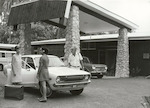 Title: 
Pacific Islands - Cook Islands - Rarotonga - People

Publicity Caption:
Mrs Johnston, receptionist, John Davey, in front of Trailways Hotel, Rarotonga  

Photographer:
Neill
