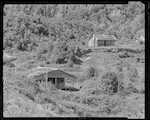 Caption: Bell Hill, an old sawmill township. 
Classification: 96 Camps/Houses. Historical. 
Photographer: J.H. Johns
Date: 1954