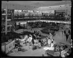 Title:
Shops

Publicity Caption:
Interior views of St Lukes shopping mall at Mount Albert.  This is one of the most modern shopping areas in New Zealand.  Auckland Province.

Photographer:
Anderson.